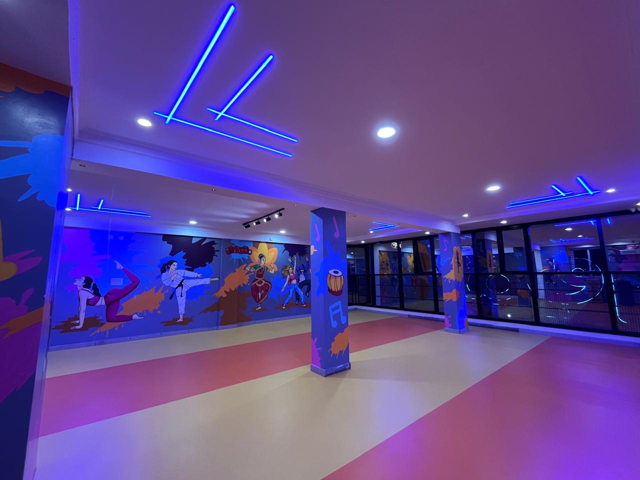 Panoramic view of studio dance arena with glass partitions and ambient light